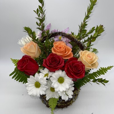 half dozen roses and daisies in a basket